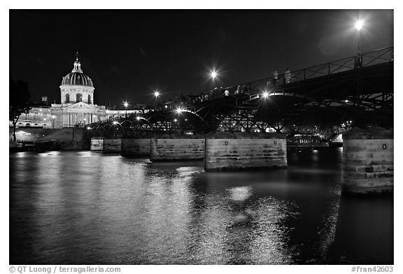 Institut de France, Pont des Arts and Seine reflections at night. Paris, France (black and white)