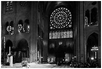 Bishop celebrating mass, South transept, and stained glass rose. Paris, France ( black and white)