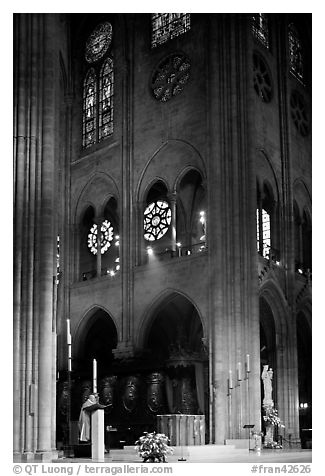 Cardinal reading and choir of Notre-Dame cathedral. Paris, France