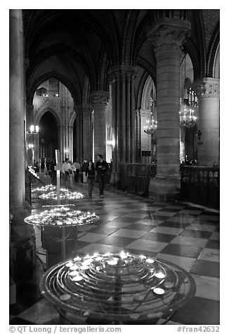Candles in aisle, Notre-Dame-de-Paris. Paris, France