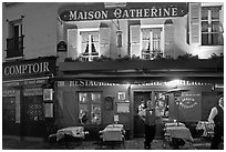 Restaurant and waiter at night, Montmartre. Paris, France ( black and white)