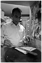 Man preparing a crepe, Montmartre. Paris, France ( black and white)