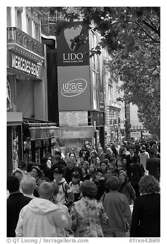 Pedestrians on a Champs-Elysees sidewalk. Paris, France (black and white)