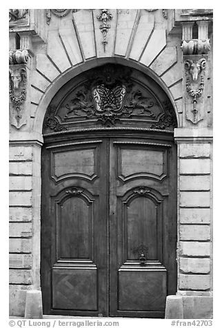 Ancient wooden door, le Marais. Paris, France (black and white)