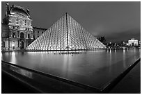IM Pei Pyramid and reflection ponds at night, The Louvre. Paris, France ( black and white)