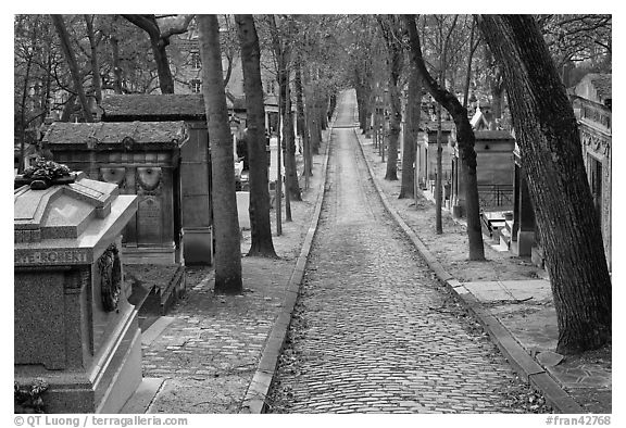 Alley and tombs in winter, Pere Lachaise cemetery. Paris, France (black and white)