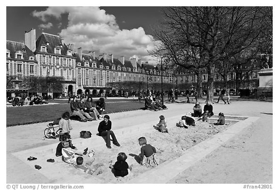 Children playing in sandbox, Place des Vosges. Paris, France (black and white)