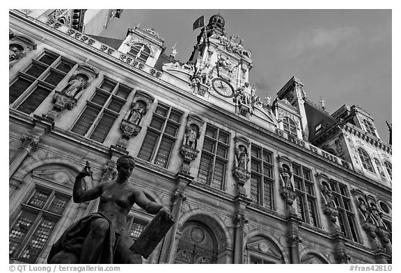 Statue Science by Jules Blanchard and Hotel de Ville at sunset. Paris, France (black and white)
