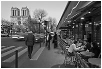 Cafe, street, and Notre Dame at dusk. Quartier Latin, Paris, France ( black and white)