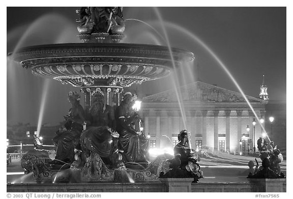 Fountain on Place de la Concorde and Assemblee Nationale by night. Paris, France (black and white)