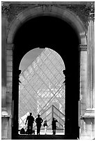 Pyramid seen through one of the Louvre's Gates. Paris, France ( black and white)
