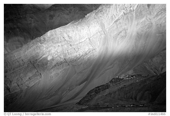 Monastary dwarfed by huge cliffs, Zanskar, Jammu and Kashmir. India