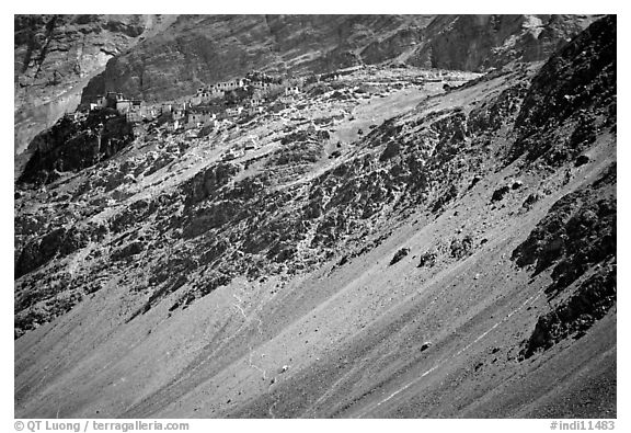 Rocky slopes topped by village and gompa, Zanskar, Jammu and Kashmir. India