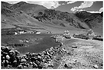 Stone fence, chortens, cultivations, and village, Zanskar, Jammu and Kashmir. India ( black and white)