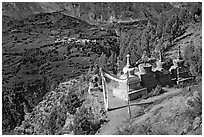 Prayer flag, chortens, and verdant valley below, Himachal Pradesh. India ( black and white)