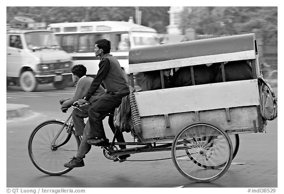 Cycle-rickshaw pulling a box for carrying schoolchildren. New Delhi, India (black and white)