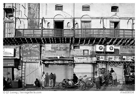 Street with old buildings and storefronts closed, Old Delhi. New Delhi, India (black and white)