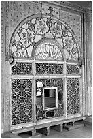 Marble door carved from a single slab with justice symbols, Diwan-i-Khas, Red Fort. New Delhi, India (black and white)