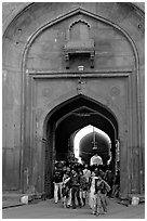 People walking out of the Covered Bazar, Red Fort. New Delhi, India ( black and white)