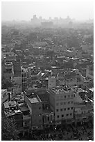 View of Old Delhi from above with high rise skyline in back. New Delhi, India ( black and white)