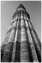 Qutb Minar seen from base, tallest brick minaret in the world. New Delhi, India ( black and white)
