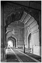 Muslim man in prayer, prayer hall, Jama Masjid. New Delhi, India ( black and white)