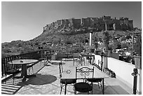 Rooftop restaurant with view on Mehrangarh Fort. Jodhpur, Rajasthan, India ( black and white)