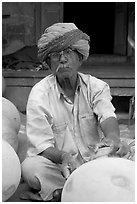 Man with turban holding a jar. Jodhpur, Rajasthan, India ( black and white)
