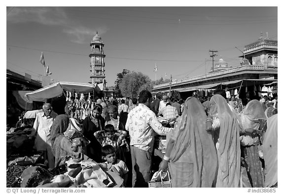 Sadar Market, with women in colorful sari and clock tower. Jodhpur, Rajasthan, India (black and white)
