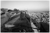 Couple looking at the view from Mehrangarh Fort. Jodhpur, Rajasthan, India ( black and white)