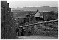 Family atop the walls of Mehrangarh Fort at sunset, Mehrangarh Fort. Jodhpur, Rajasthan, India (black and white)
