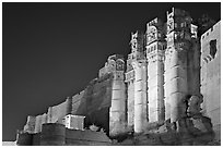Towers and 36m high walls of Mehrangarh Fort by night. Jodhpur, Rajasthan, India ( black and white)