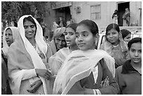 Women standing in the street during a wedding. Jodhpur, Rajasthan, India ( black and white)