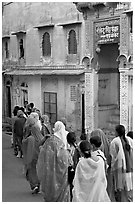 Women walking in a narrow old town street. Jodhpur, Rajasthan, India ( black and white)