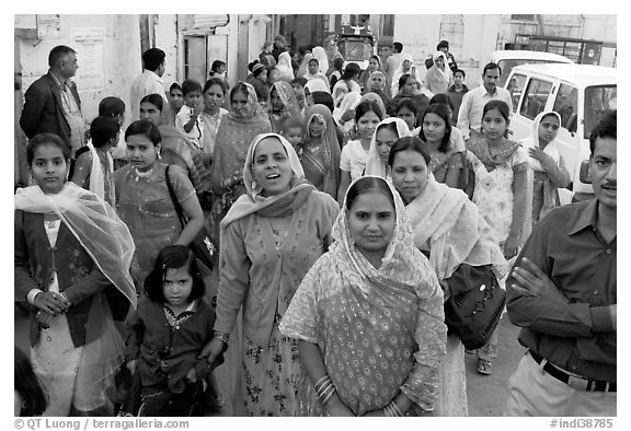 Old town street with wedding procession. Jodhpur, Rajasthan, India (black and white)