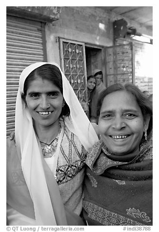 Smiling women in old street. Jodhpur, Rajasthan, India (black and white)