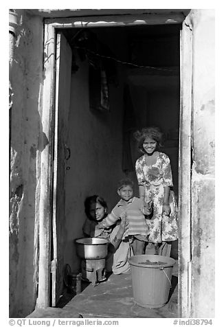 Family inside doorway. Jodhpur, Rajasthan, India (black and white)