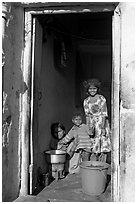 Family inside doorway. Jodhpur, Rajasthan, India ( black and white)
