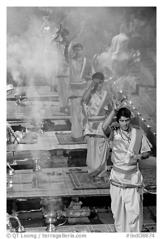 Five young Brahmans performing puja ceremony in the evening. Varanasi, Uttar Pradesh, India (black and white)