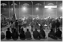 Worshipers attending arti ceremony at Ganga Seva Nidhi. Varanasi, Uttar Pradesh, India (black and white)