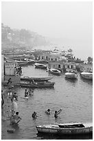 Pilgrims taking a holy dip in the Ganga River at dawn. Varanasi, Uttar Pradesh, India ( black and white)