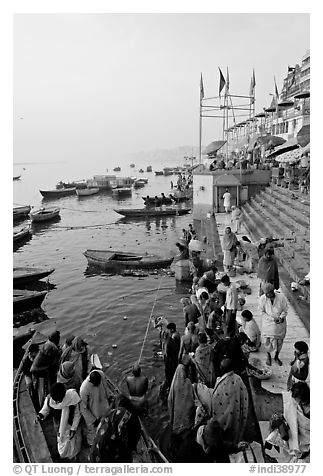 Boat unloading pilgrim onto Dasaswamedh Ghat, early morning. Varanasi, Uttar Pradesh, India