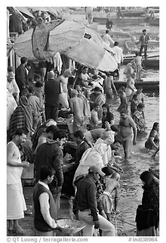 Colorful crowd at the edge of water, Dasaswamedh Ghat. Varanasi, Uttar Pradesh, India (black and white)