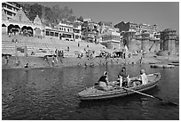 Rowboat in front of Scindhia Ghat. Varanasi, Uttar Pradesh, India (black and white)