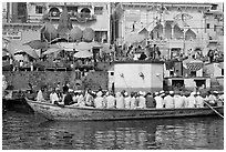 Boat packed with men near Dasaswamedh Ghat. Varanasi, Uttar Pradesh, India ( black and white)