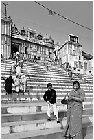 Woman and boy on temple steps, Kedar Ghat. Varanasi, Uttar Pradesh, India ( black and white)