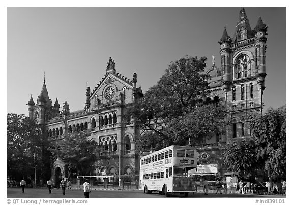 Yellow double-decker bus in front of Victoria Terminus. Mumbai, Maharashtra, India (black and white)
