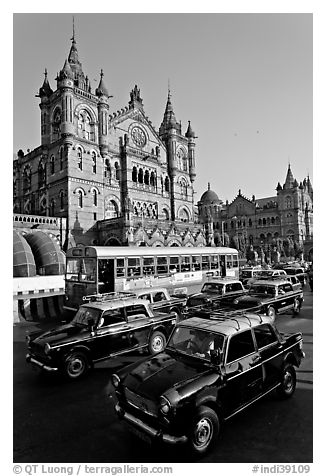 Black and Yellow cabs in front of Victoria Terminus. Mumbai, Maharashtra, India