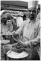 Cooks in food stall, Chowpatty Beach. Mumbai, Maharashtra, India ( black and white)