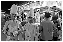 Cooks in front of Panipuri stall, Chowpatty Beach. Mumbai, Maharashtra, India ( black and white)